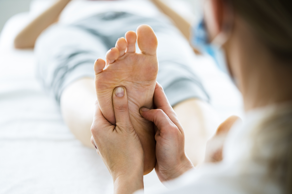 Chiropractor Evaluating Shoulder Injury After Car Accident - Auto Accident Chiropractor in Parkland